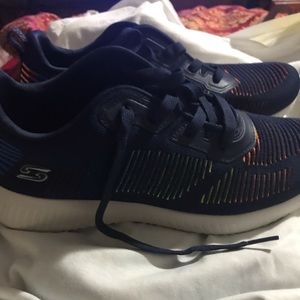 Dark blue Skechers sneakers, good walking shoes.